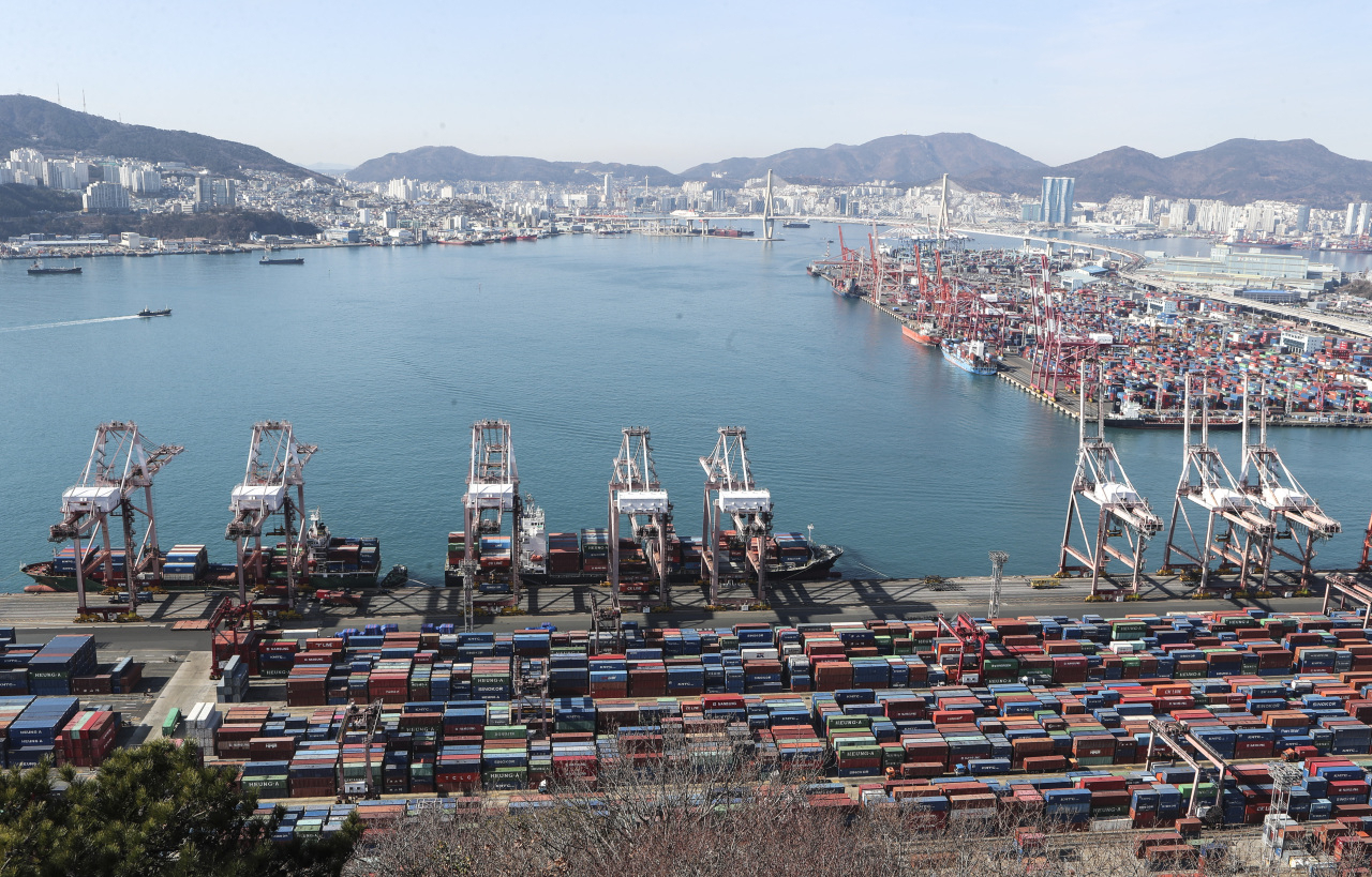 Containers are stacked up for outbound shipments at Gamman Pier in Busan on Jan. 21, 2022. (Yonhap)