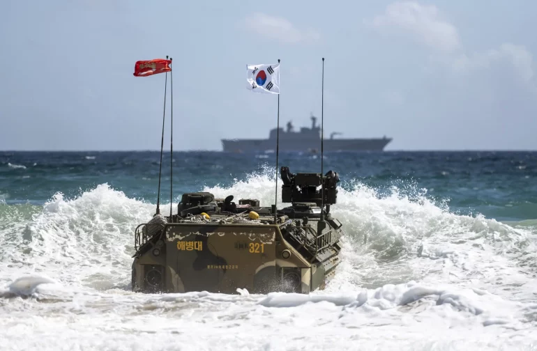220730-N-LI768-1225 MARINE CORPS BASE HAWAII, Hawaii (July 30, 2022) A Korean amphibious assault vehicle from the Republic of Korea Marines departs Pyramid Rock Beach to return to amphibious assault ship ROKS Marado (LPH 6112) following an amphibious raid during a multinational littoral operations exercise as part of Rim of the Pacific (RIMPAC) 2022. Twenty-six nations, 38 ships, three submarines, more than 170 aircraft and 25,000 personnel are participating in RIMPAC from June 29 to Aug. 4 in and around the Hawaiian Islands and Southern California. The world’s largest international maritime exercise, RIMPAC provides a unique training opportunity while fostering and sustaining cooperative relationships among participants critical to ensuring the safety of sea lanes and security on the world’s oceans. RIMPAC 2022 is the 28th exercise in the series that began in 1971. (U.S. Navy photo by Mass Communication Specialist 1st Class Devin M. Langer)